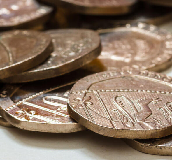 A close up shot of a set of 20p coins on a table